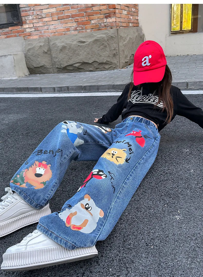 New 2024 Teenage Girls Blue Street Cartoon Print Elastic Mid Waist Loose Denim Jeans Spring Fashion Children Cute Wide Leg Pants